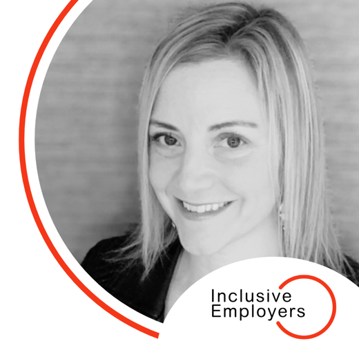 Image shows Cheryl smiling at the camera and the Inclusive Employers logo below